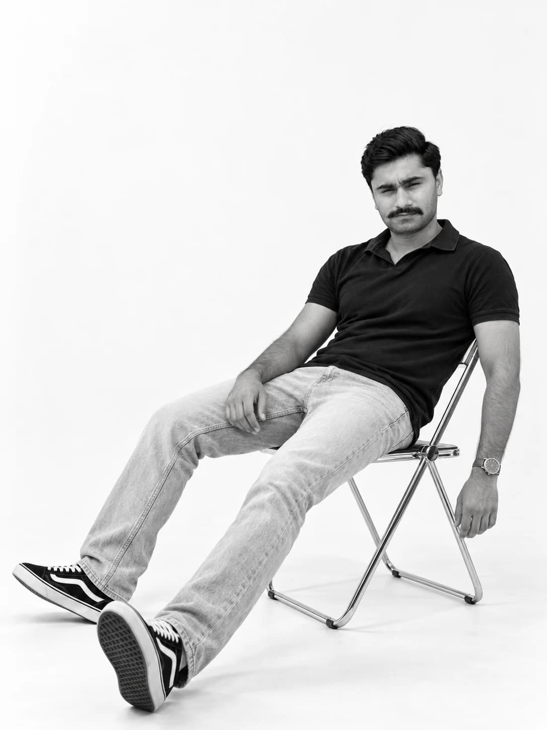 Ghulam Murtaza seated in a black-and-white studio portrait